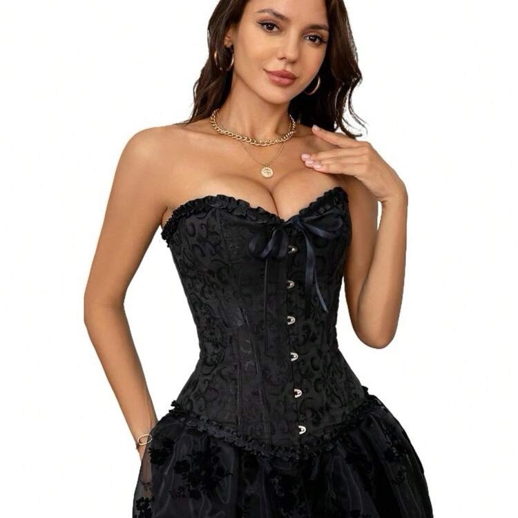 Black jacquard corset worn by brunette woman